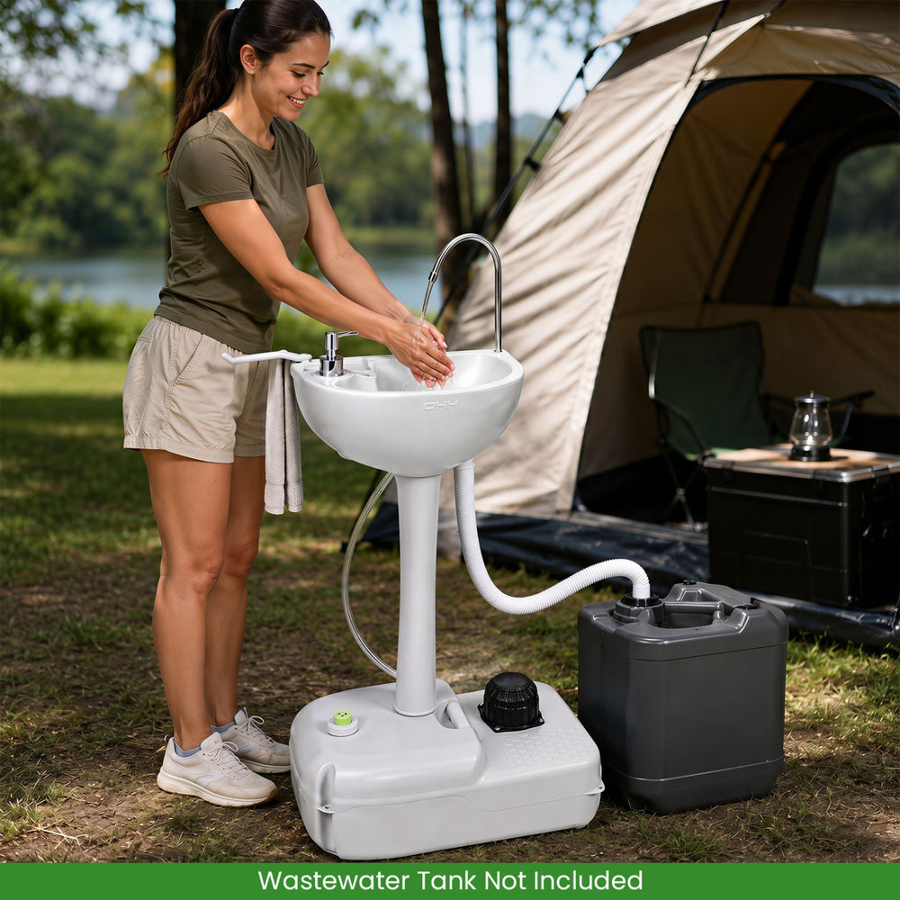 Portable foot pump camping sink with large basin, soap dispenser, and wheels for easy movement at outdoor events.