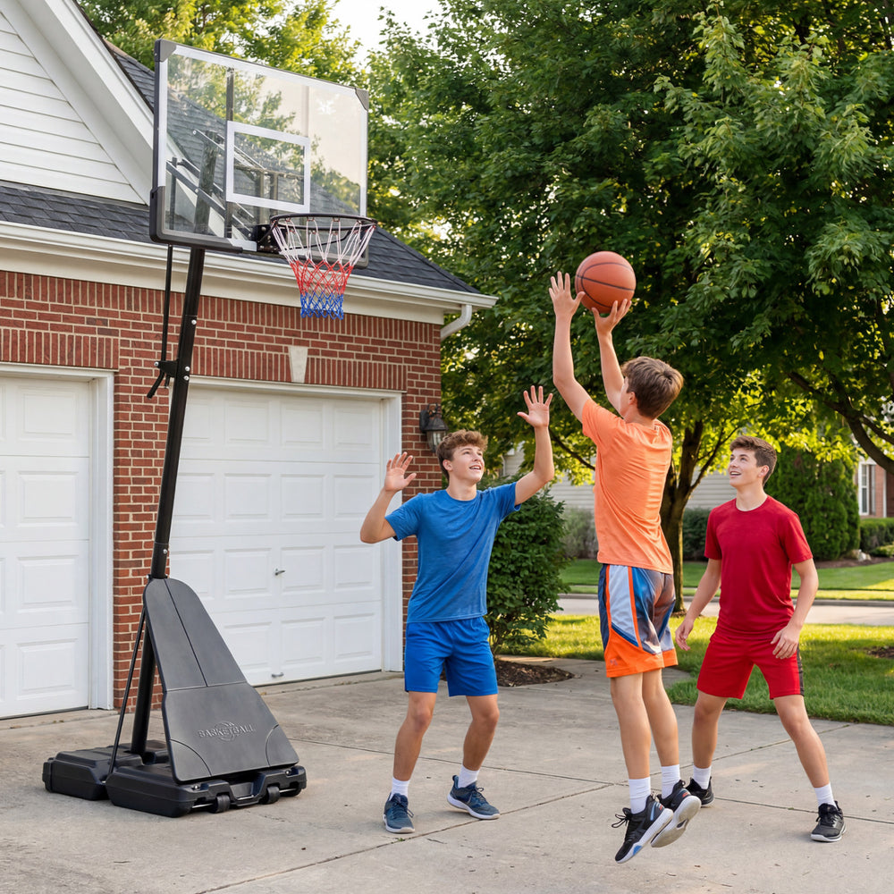 Portable outdoor basketball hoop with adjustable height, shatterproof backboard, and sturdy base for stability during play.