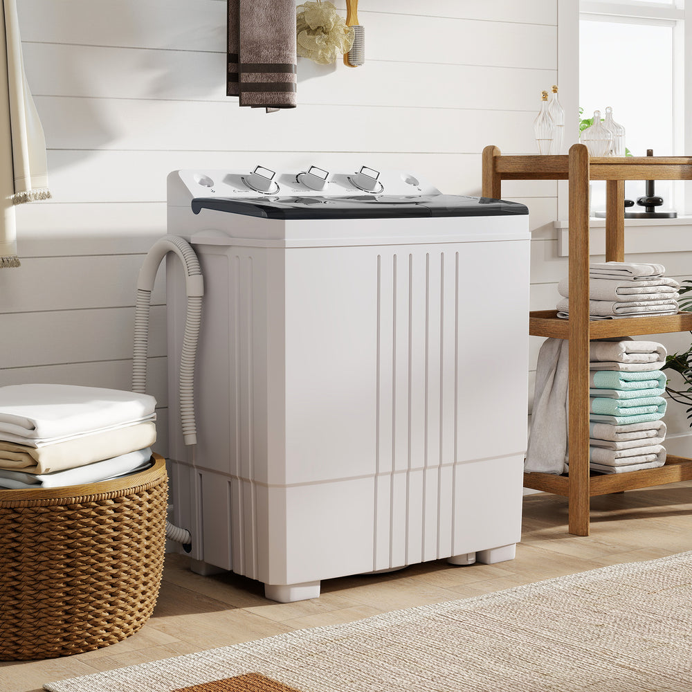 Portable washing machine with built-in drain pump, 12 lbs capacity, designed for home and RV use, featuring a compact.