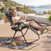 Portable zero gravity chair in gray with cup holder tray, perfect for outdoor relaxation and easy transport.