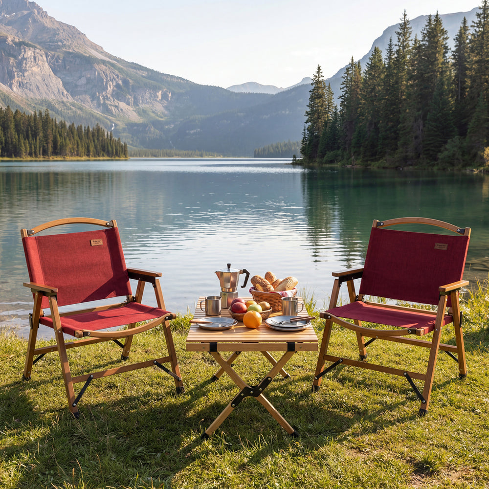 Red portable folding camping chair with bamboo frame, perfect for outdoor picnics by the lake.