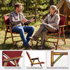 Portable folding camping chair in red with bamboo frame, curved backrest, and smooth armrests for comfortable outdoor.