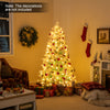 Pre-lit artificial Christmas tree with snow flocked branches, adorned with frosted red berries, for festive home decor.