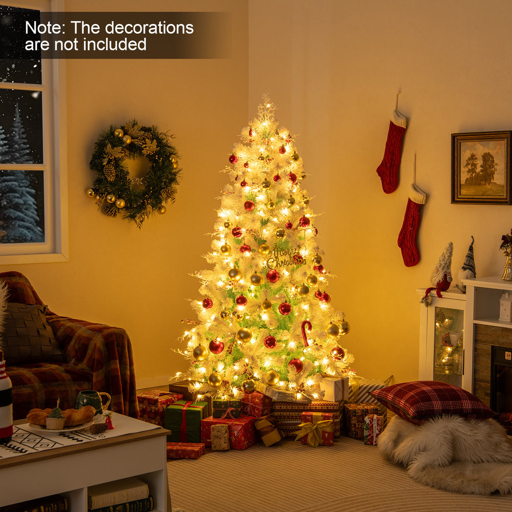 Pre-lit artificial Christmas tree with snow flocked branches, adorned with frosted red berries, for festive home decor.