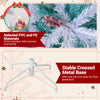Pre-lit artificial Christmas tree with snow flocked branches and stable crossed metal base for easy setup and floor.