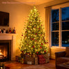 Pre-lit artificial Christmas tree with multicolored LED lights, glowing warmly beside a fireplace and wrapped gifts.