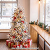 Pre-lit artificial Christmas tree with warm white LED lights, snow flocking, and a stable metal base for festive displays.