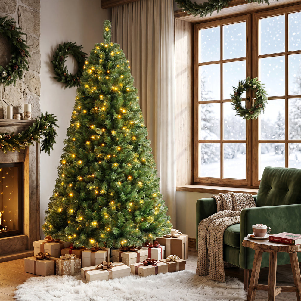 Pre-lit 6-foot green artificial Christmas tree with full branch tips and 600 LED lights, perfect for festive holiday decor.