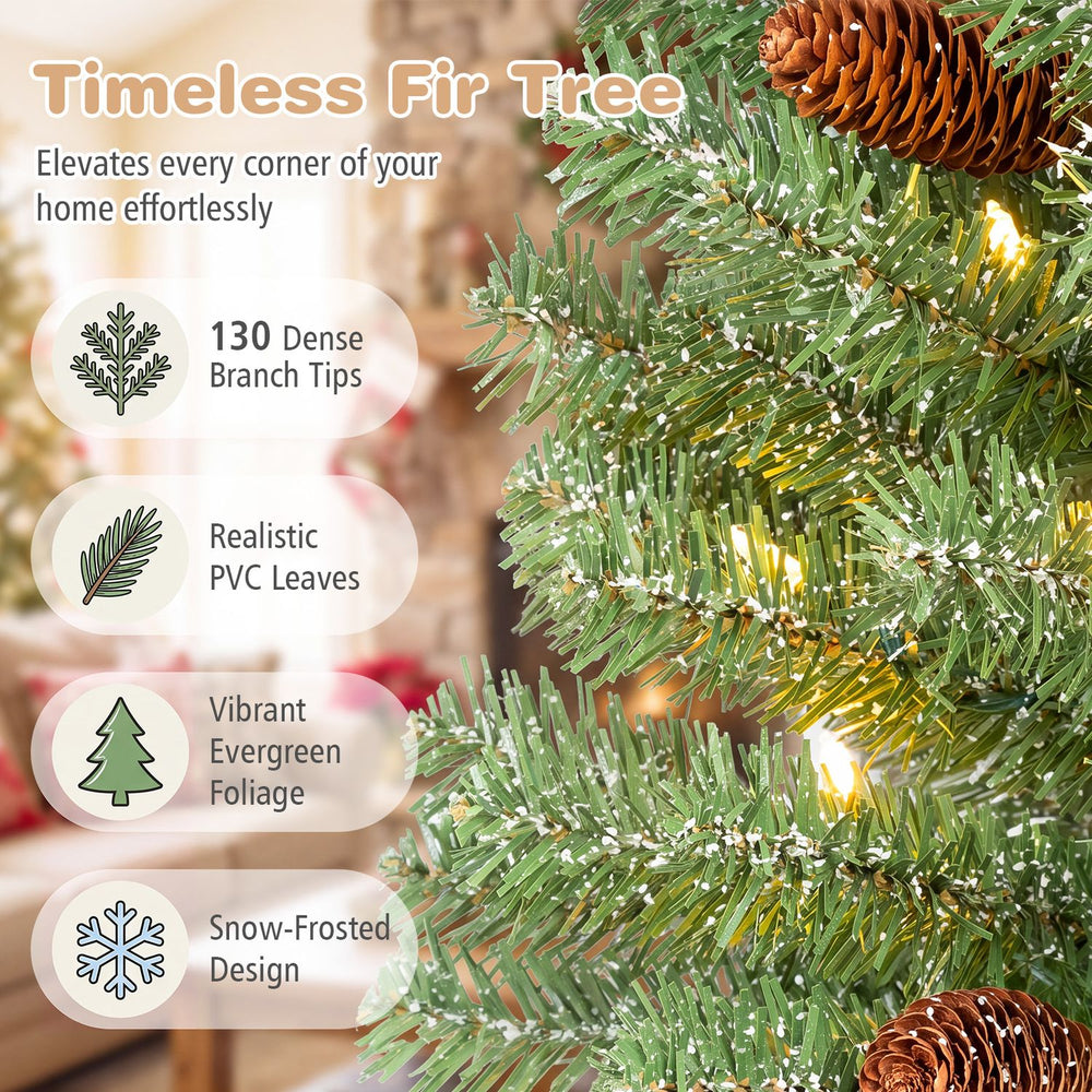 Pre-lit mini Christmas tree with snow-dusted tips, pine cones and warm white LED lights for festive small spaces.
