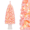 Close-up of the pink leaves on a pre-lit 4FT artificial Christmas tree with warm white LED lights for enchanting holiday decor.