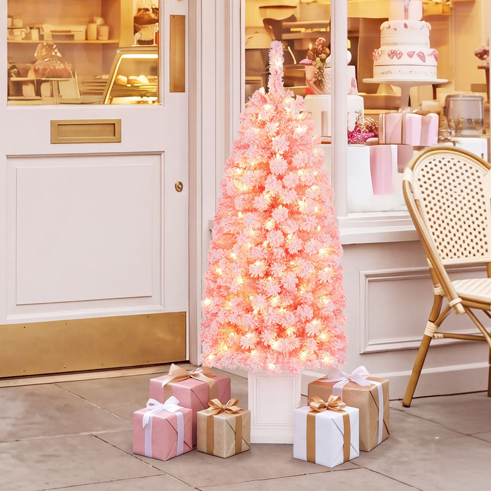 Pre-lit 4FT potted artificial Christmas tree with pink leaves and 100 warm white LED lights, perfect for festive decor.