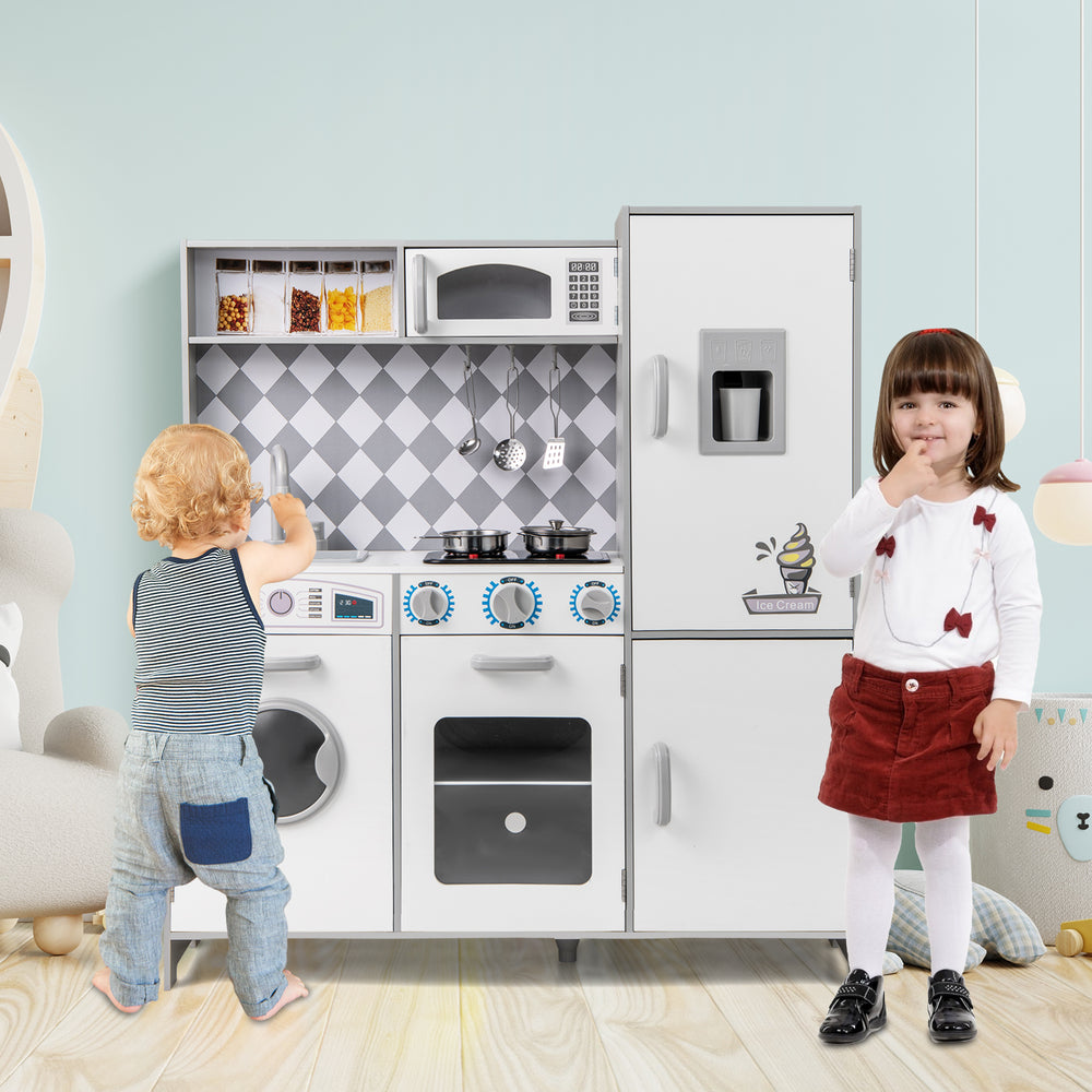 Kids playing with a white pretend play kitchen featuring lights, sounds, and realistic cooking accessories for.