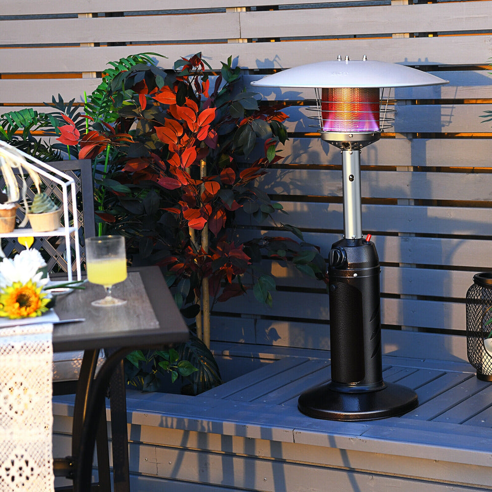 Portable tabletop propane patio heater in black, 11,000 BTU, ideal for outdoor warmth in gardens and patios.