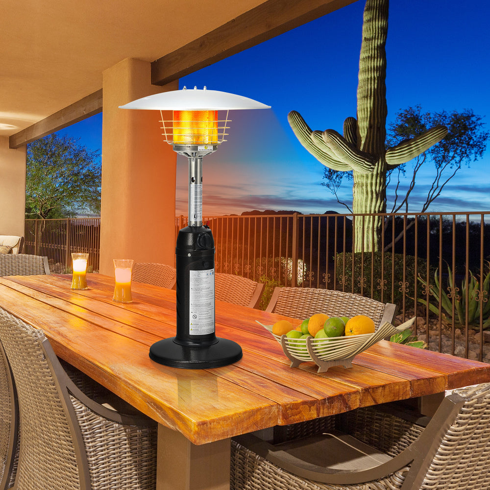 Portable tabletop propane patio heater in black, providing 11,000 BTU heat for outdoor dining and gatherings.