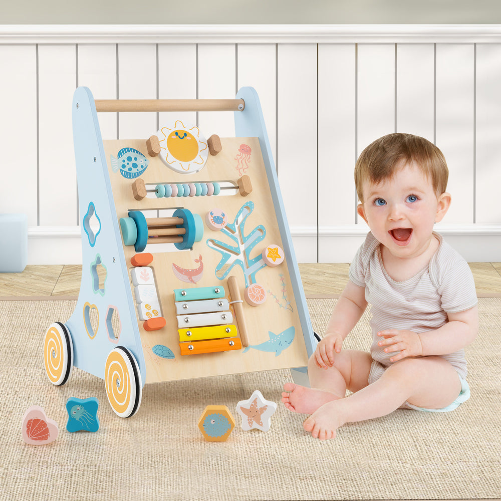 Wooden baby walker in blue with a sturdy triangular design, featuring multiple beads and an acrylic mirror for sensory.