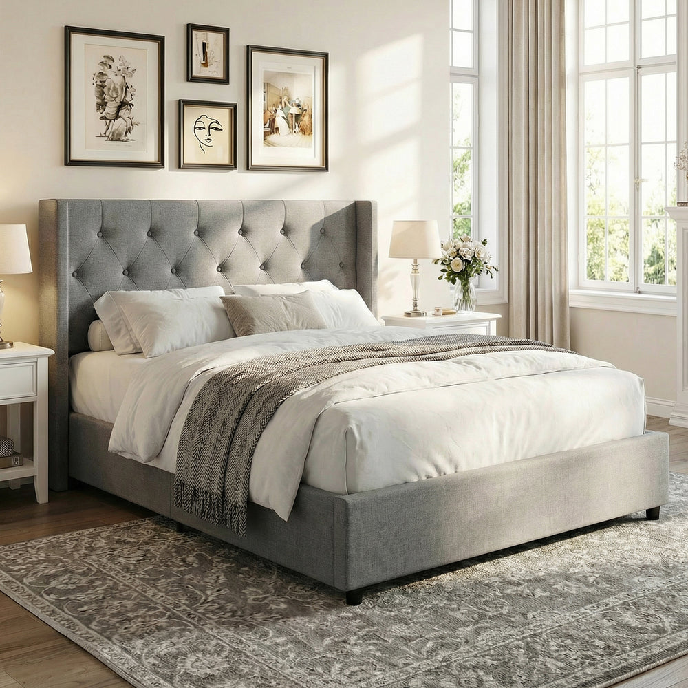 Queen size gray upholstered platform bed with tufted wingback headboard and lift-up storage for efficient organization.