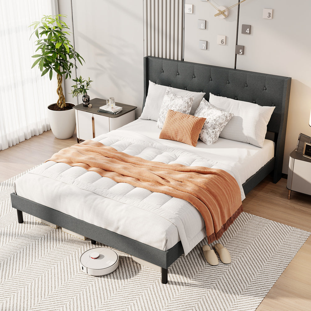 Gray queen size upholstered bed frame with wingback headboard, showcasing a cozy design and spacious under-bed area for.