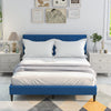 Queen size upholstered platform bed in blue showcasing a padded headboard and stylish design, suitable for any bedroom.