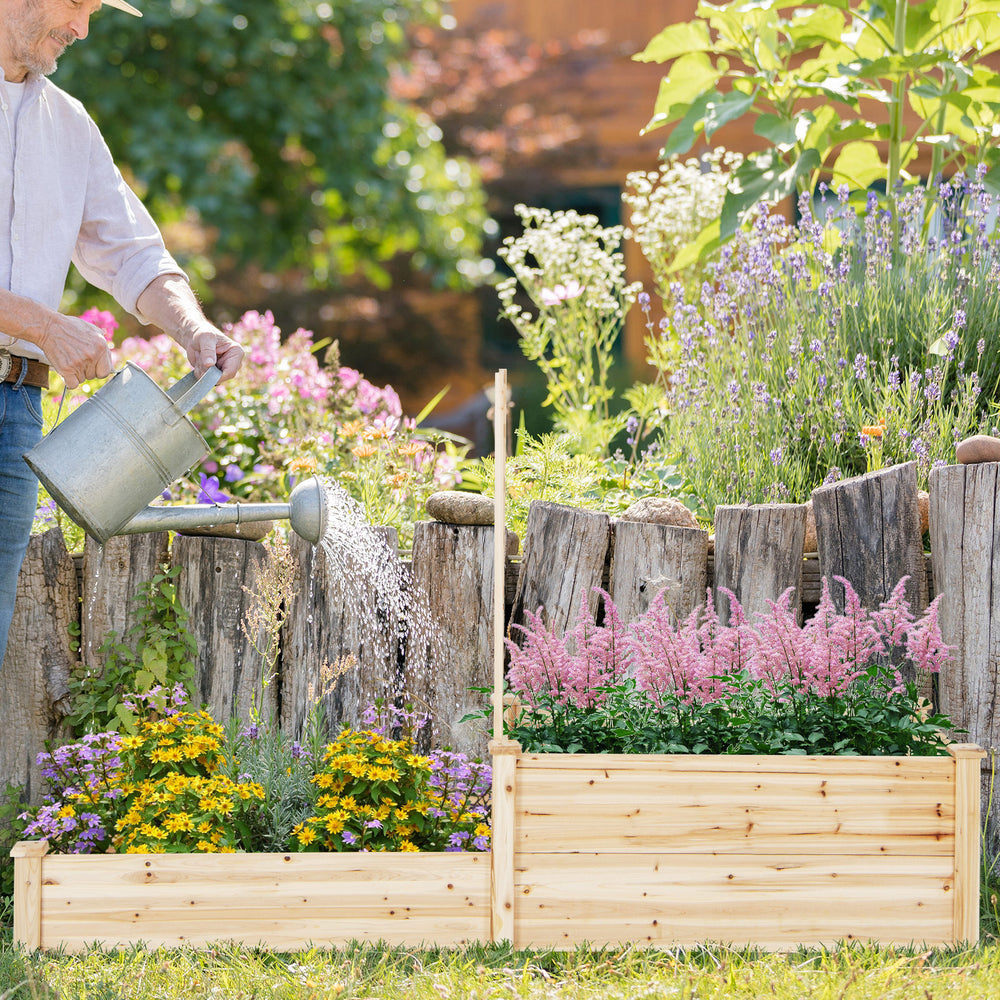 Watering vibrant flowers in the raised garden bed with trellis made of durable fir wood, showcasing two large planter.