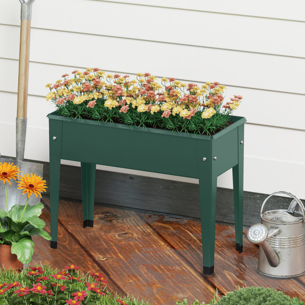 Elevated green metal gardening box with legs, designed for easy planting and excellent weather resistance.