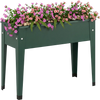 Elevated green metal gardening box with legs, featuring flowers, designed for easy planting and healthy growth.