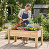 Elevated wooden planter box filled with colorful flowers, ideal for growing herbs and vegetables in any outdoor space.