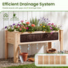 Elevated planter box made of solid fir wood with drainage holes, perfect for growing herbs and vegetables outdoors.