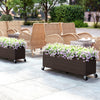 Raised garden bed planter box made of PE rattan with wheels, ideal for outdoor patios and cultivating flowers.