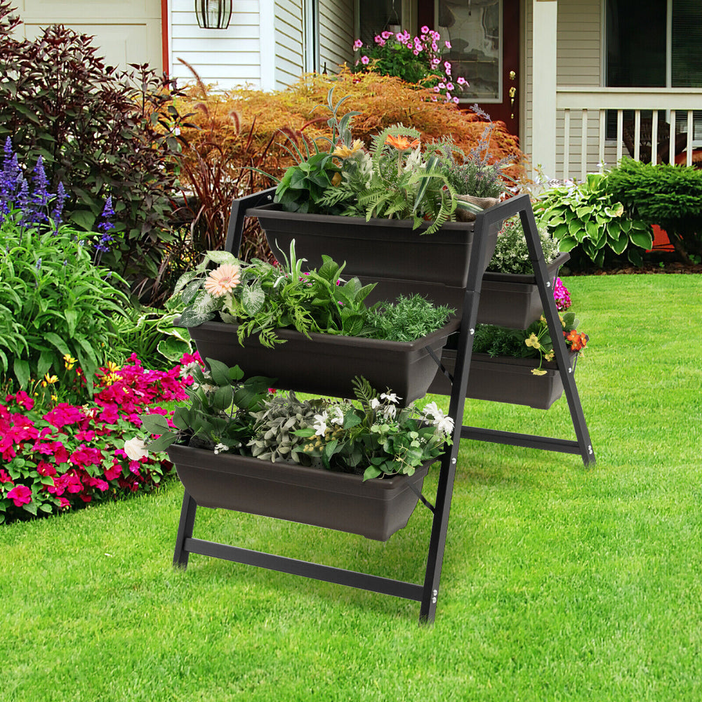 3-tier vertical raised garden bed with 5 plant boxes in a garden, made of durable PE material for space-saving planting.