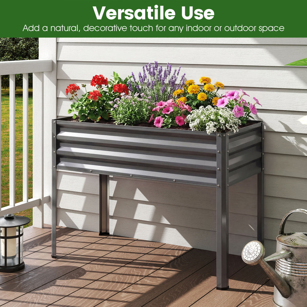 Large elevated planter box in grey, featuring a 32" height for comfortable gardening and drainage holes for healthy.