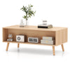 Mid-century modern rattan coffee table with two storage drawers and open compartment, perfect for stylish living room.