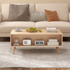 Mid-century modern rattan coffee table with two storage drawers, showcasing natural wood finish and spacious open.