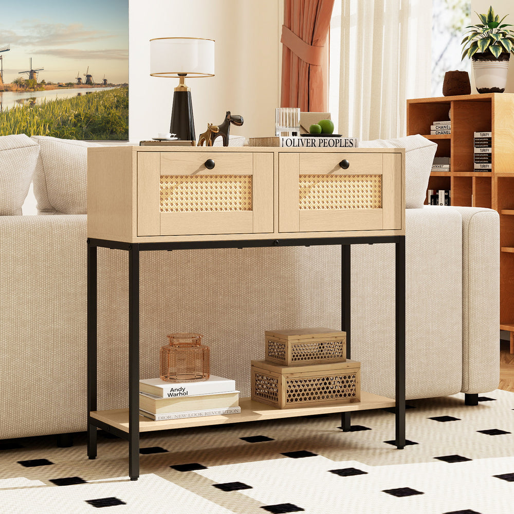 Boho-inspired rattan console table with two drawers and open shelf, perfect for entryways or living rooms.