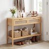 Natural rattan console table with two drawers and bottom shelf, ideal for decorative display and organized storage.