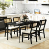 Set of four black rattan dining chairs with padded seats and rubber wood legs, ideal for kitchen dining.
