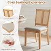 Rattan dining chair with curved backrest, padded seat, and natural wood finish for comfortable dining experiences.