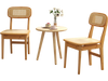 Set of 2 natural rattan dining chairs with ergonomic backrests, perfect for living or dining room use.