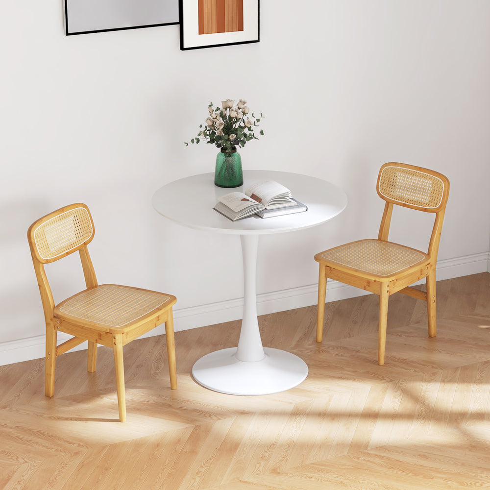Set of 2 natural rattan dining chairs with ergonomic backrest, perfect for dining or living room use.