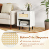 Rattan nightstand in white with a drawer and open shelf, featuring sturdy metal legs for stability and boho-chic.