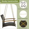 Single rattan porch swing with acacia wood armrests, soft cushion, and sturdy hooks for outdoor relaxation.