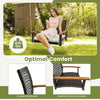 Single rattan porch swing with acacia wood armrests and cushion, designed for outdoor comfort and holds up to 400 lbs.