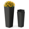 Tall and short black rattan planters set with removable trays, ideal for outdoor patios and gardens.