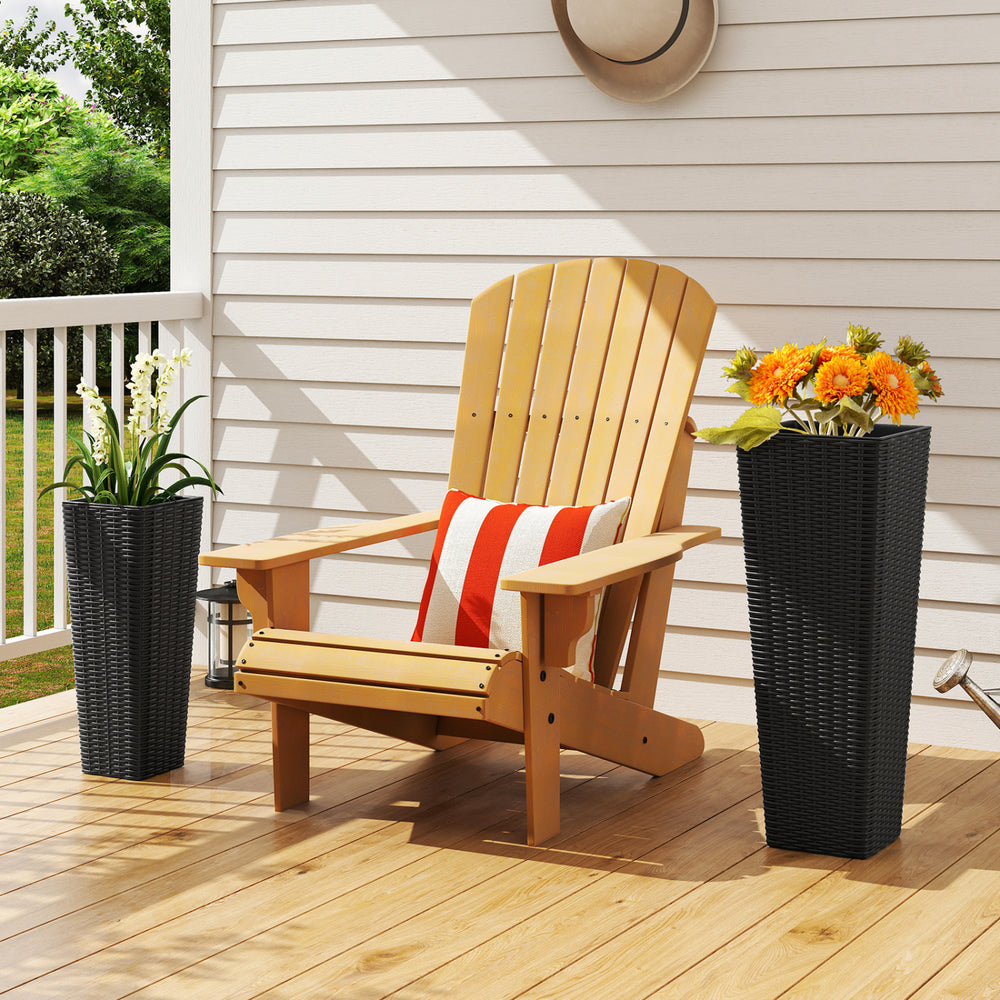 Tall black rattan planter set with removable trays, perfect for outdoor patios and gardens, showcasing a textured.