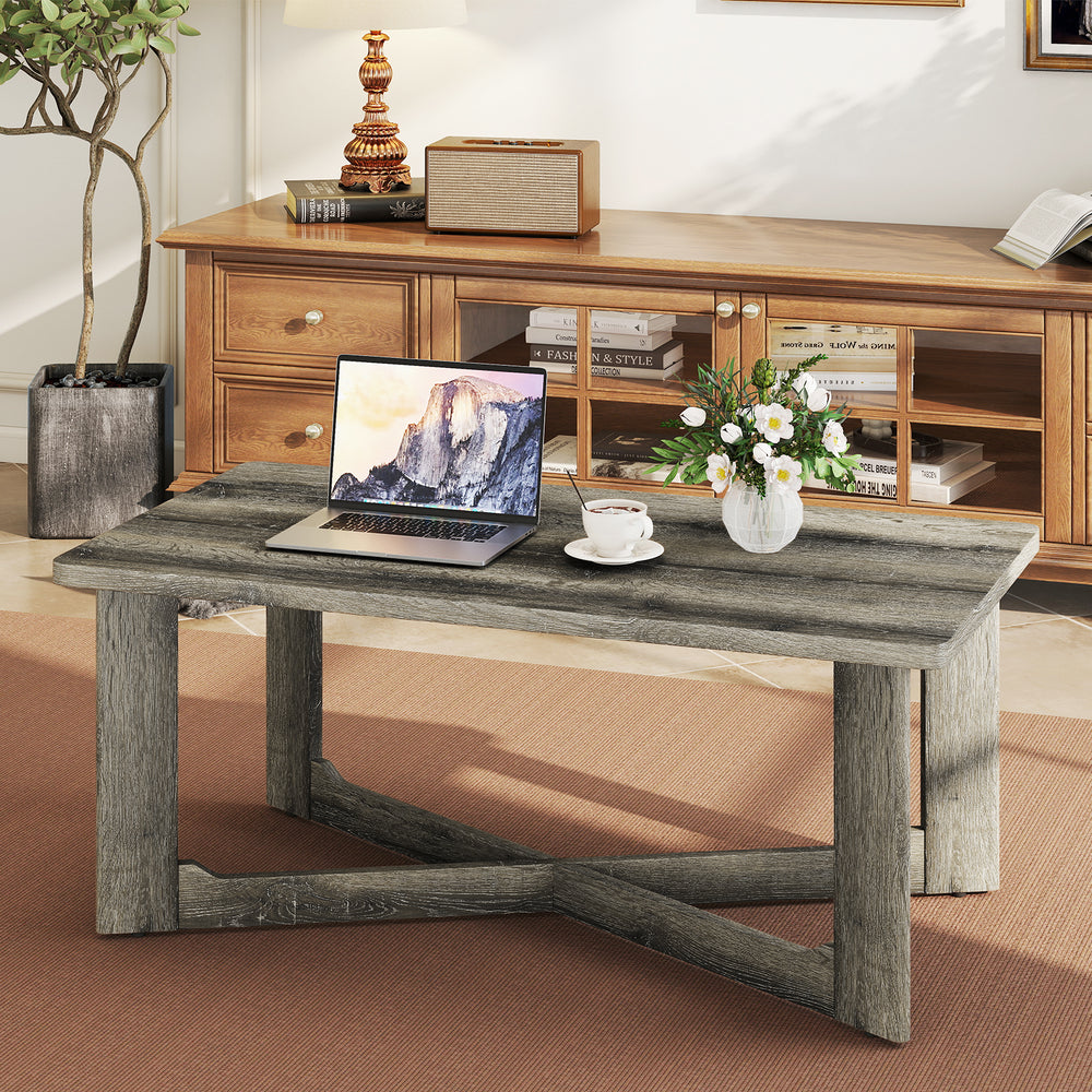 Rectangle coffee table with gray rubber wood base and X-shaped design, ideal for living room essentials and stability.