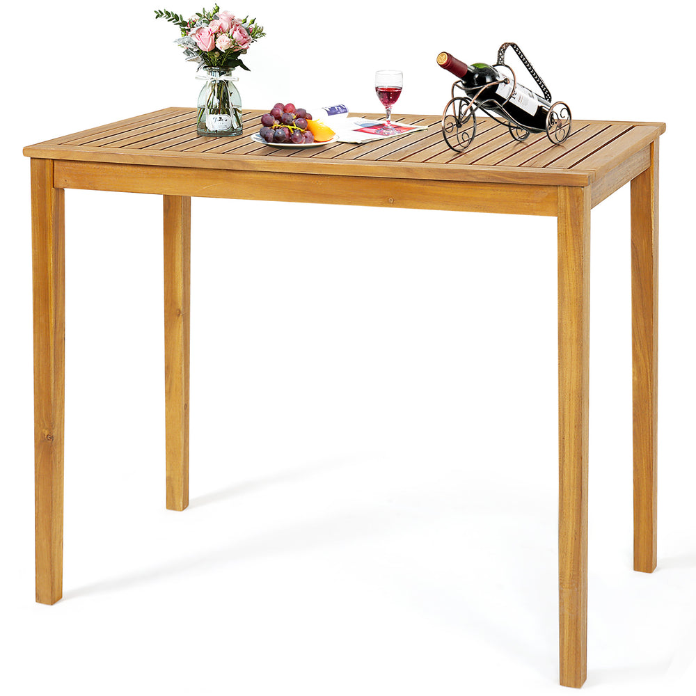 Rectangular acacia wood bar height table with spacious tabletop, perfect for outdoor dining and gatherings on the patio.