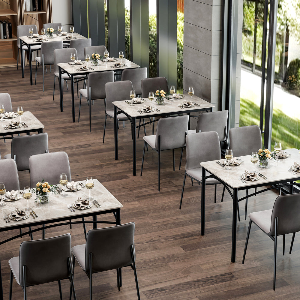 Rectangular modern dining table for 4 with grey sintered stone top and sturdy metal frame, ideal for restaurants or.