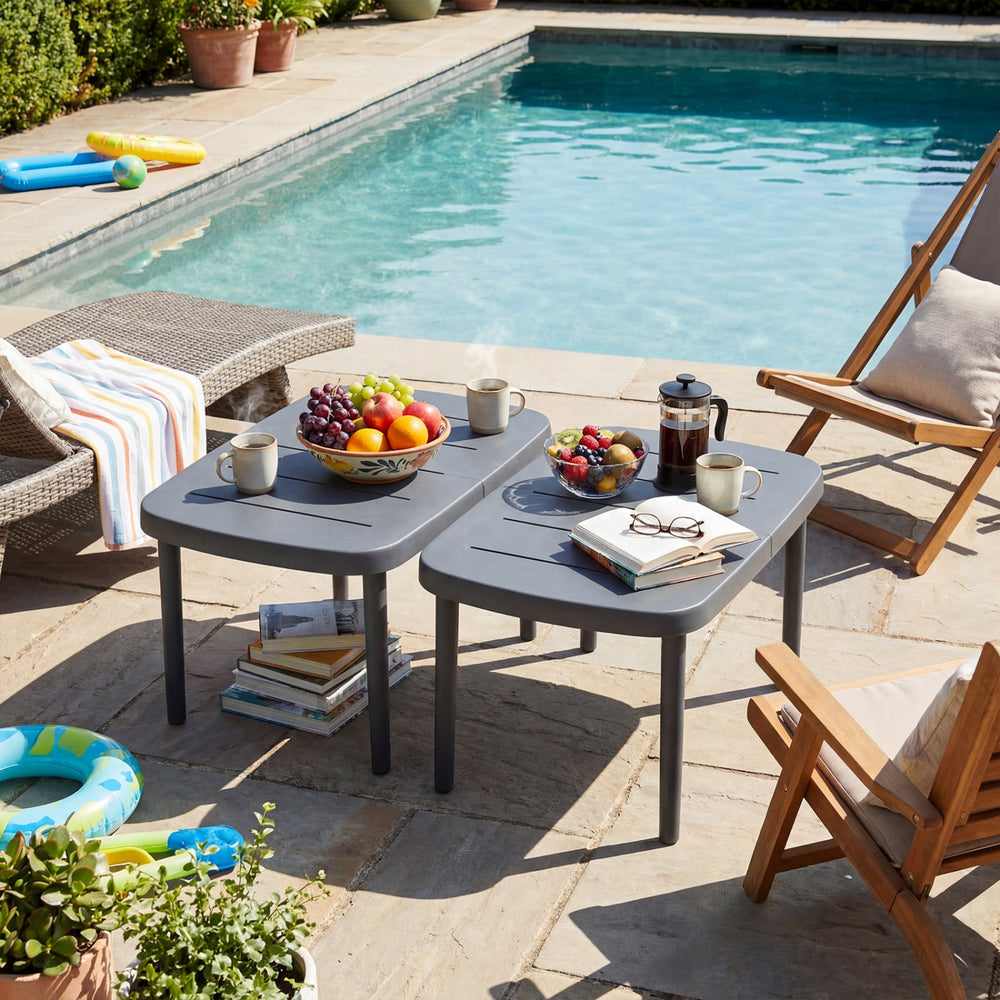 Rectangular gray patio side table with aluminum alloy rods, ideal for poolside snacks and beverages.