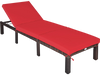 Red cushioned outdoor rattan chaise lounge with adjustable backrest, perfect for patio or poolside relaxation.