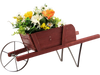 Wooden wagon planter in red with flowers, made of solid pine wood, ideal for garden decoration or holiday displays.