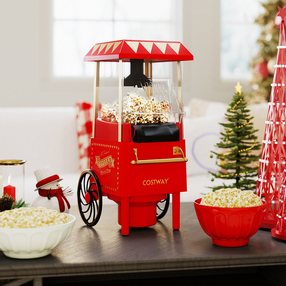 Retro hot air popcorn maker in red with kernel measuring cup, perfect for healthy popcorn at family movie nights.